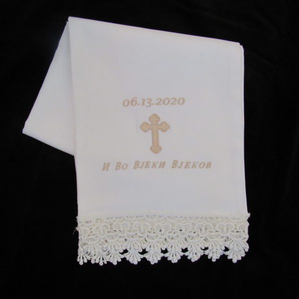 White Orthodox bridal cloth with golden embroidery and beautiful lace.